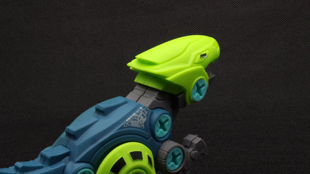 Dinosaur toy isolated on black backgroundの写真素材