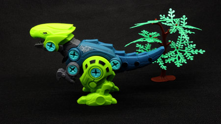 Dinosaur toy isolated on black backgroundの写真素材