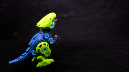 Dinosaur toy isolated on black backgroundの写真素材