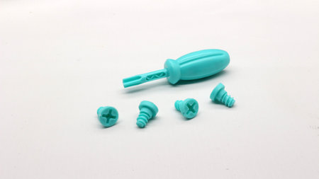 Blue screwdriver toy and screws isolated on white backgroundの写真素材