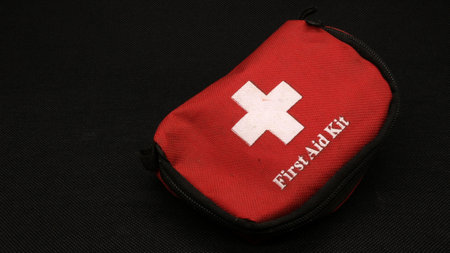 First aid kit isolated on black backgroundの写真素材