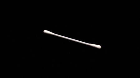 Cotton swabs for cleaning ears isolated on black backgroundの写真素材