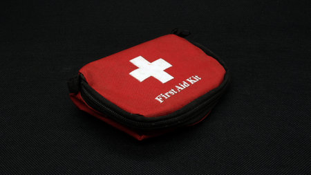 First aid kit isolated on black backgroundの写真素材