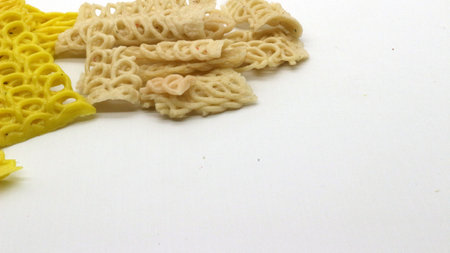 Colorful crackers or krupuk unfried isolated on white backgroundの写真素材