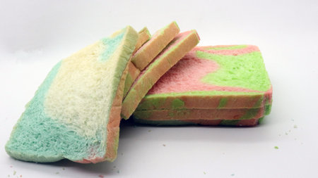 Sliced rainbow bread isolated on white backgroundの写真素材