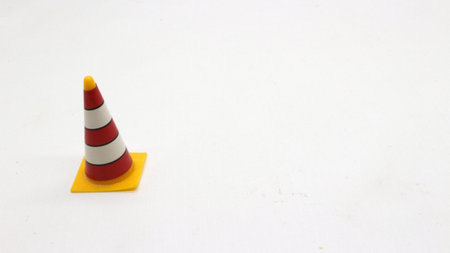 Traffic cone toys are made of plastic with a white background.の写真素材