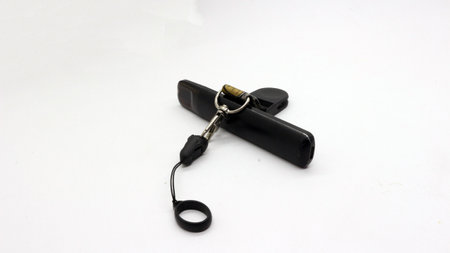 Black vape or electronic cigarette with hanger, white backgroundの写真素材