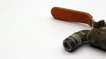 Broken and rusty water tap with white backgroundの写真素材