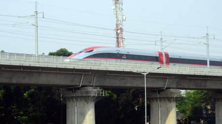 Beautiful view of fast train passing on the tracks in the city