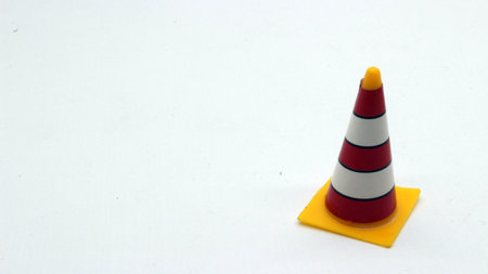 Traffic cone toys are made of plastic with a white background.の写真素材