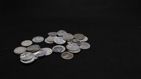Stack of Indonesian coins isolated on black background