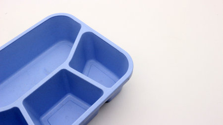 Blue plastic lunch box isolated on white background