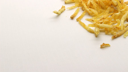 Thinly sliced potatoes fried with spicy spices or what is usually called mustofa potatoes, a traditional Indonesian foodの写真素材