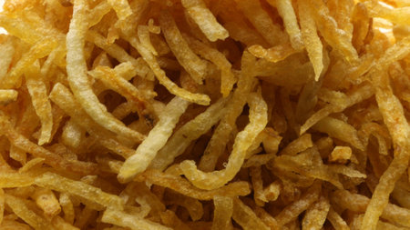 Thinly sliced potatoes fried with spicy spices or what is usually called mustofa potatoes, a...