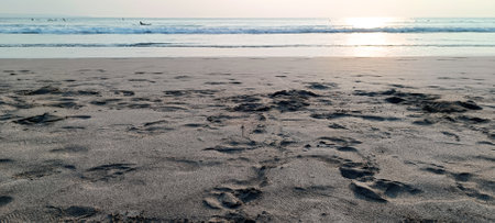 Beautiful sunset view with sand on Seminyak beach Bali