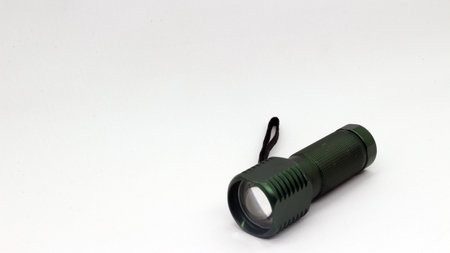 Small black flashlight isolated on white backgroundの写真素材