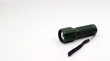 Small black flashlight isolated on white backgroundの写真素材