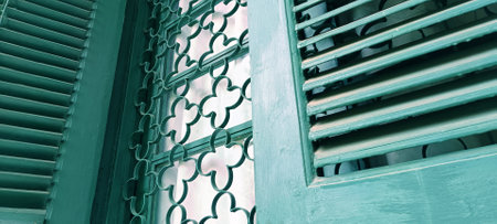 Close up of vintage green wooden window in old building