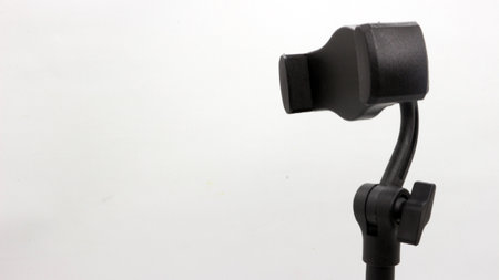Black stand holder for smart phone isolated on white backgroundの写真素材