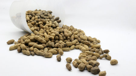 Shelled peanuts isolated on white background