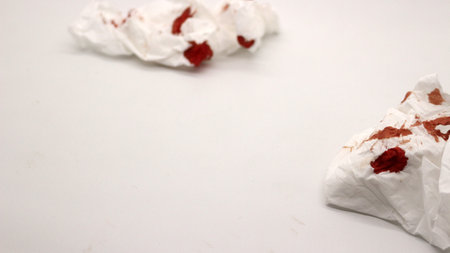 Blood stained tissue isolated on white backgroundの写真素材