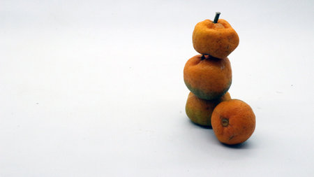 Sumo citrus or sumo orange fruit isolated on white backgroundの写真素材