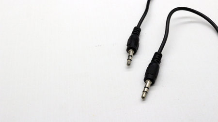 Standard 3.5mm Male to Male audio cable isolated with white background