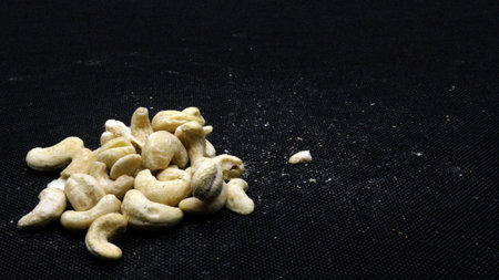 Cashew nuts isolated on black backgroundの写真素材
