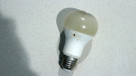 Used light bulb isolated on white background