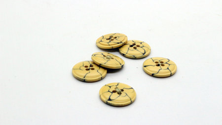 Brown clothing buttons isolated on white background