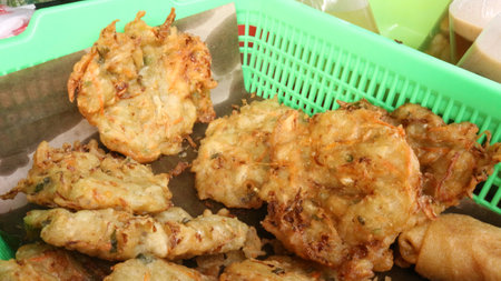 Fried bakwan served with lots of oil, traditional Indonesian food
