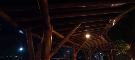 Rainy atmosphere in a traditional hut at nightの写真素材