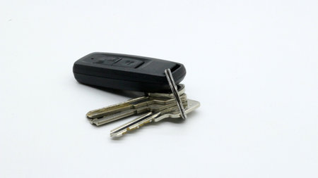 Key and keyless car isolated on white background