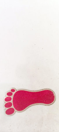 Colorful footprint stickers on stairsの写真素材