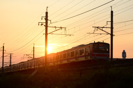 Aesthetic view of a train passing on the rails with beautiful cloudsの写真素材
