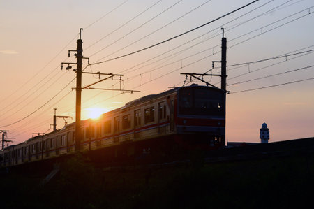 Aesthetic view of a train passing on the rails with beautiful cloudsの写真素材