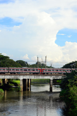 Aesthetic view of a train passing on the rails with beautiful clouds