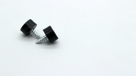 Rubber feet with screw bolts plastic feet isolated on white backgroundの写真素材