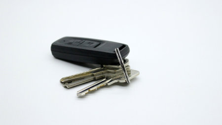 Key and keyless car isolated on white background