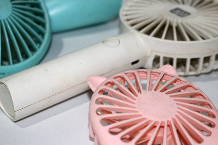 Portable handhold mini fan on white background