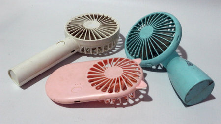 Portable handhold mini fan on white backgroundの写真素材