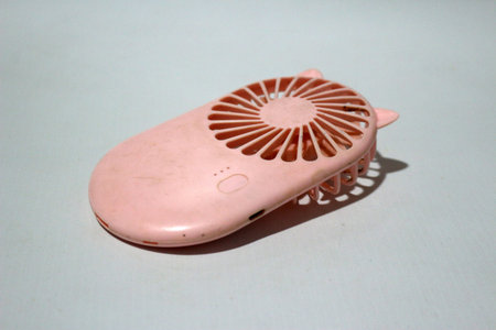 Portable handhold mini fan on white backgroundの写真素材