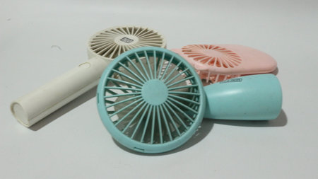 Portable handhold mini fan on white backgroundの写真素材