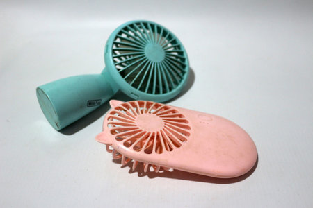 Portable handhold mini fan on white backgroundの写真素材