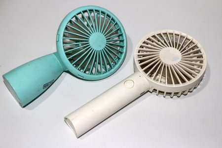 Portable handhold mini fan on white backgroundの写真素材