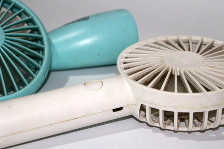 Portable handhold mini fan on white backgroundの写真素材