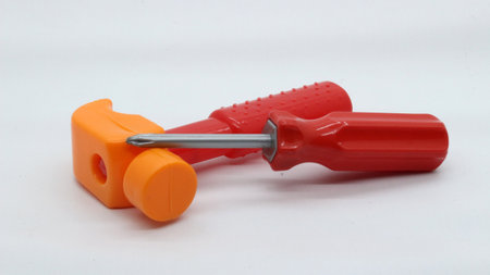 Toy hammer and screwdriver isolated on white backgroundの写真素材