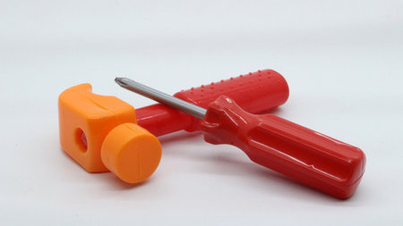 Toy hammer and screwdriver isolated on white backgroundの写真素材