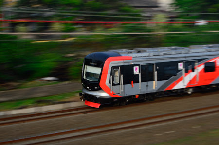 Aesthetic view of Indonesian trains passing on the railsの写真素材