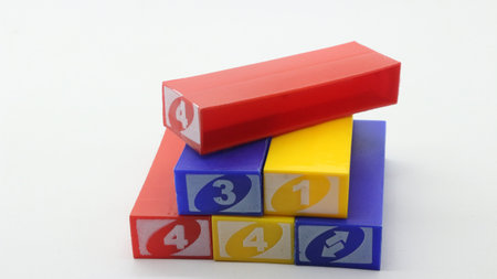 Colorful stacko blocks being played on a white background